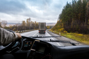 alt: truck cab interior with view of the open road 