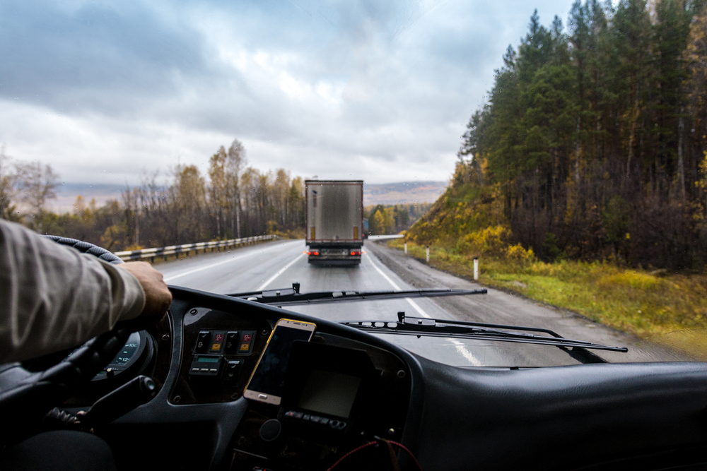 alt: truck cab interior with view of the open road
