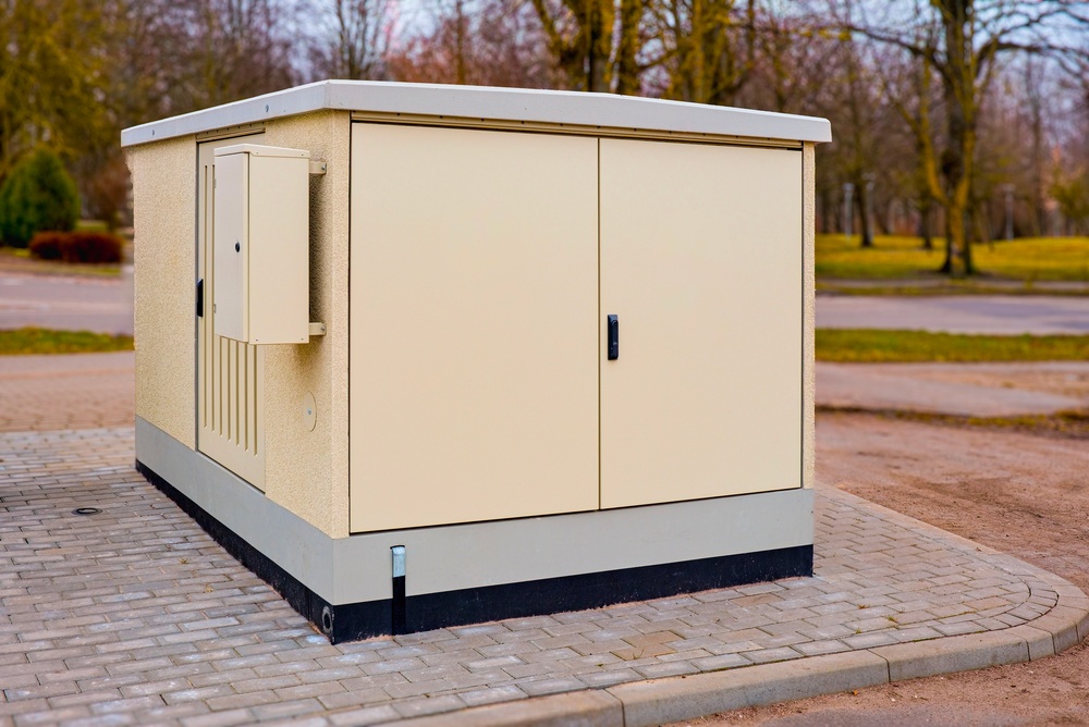metal enclosure for a power generation unit on pavement